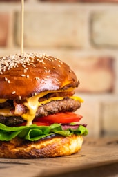 a cheeseburger with a sesame seed bun