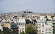 A panoramic view of Paris with the Brennus Analytics office building in the foreground.