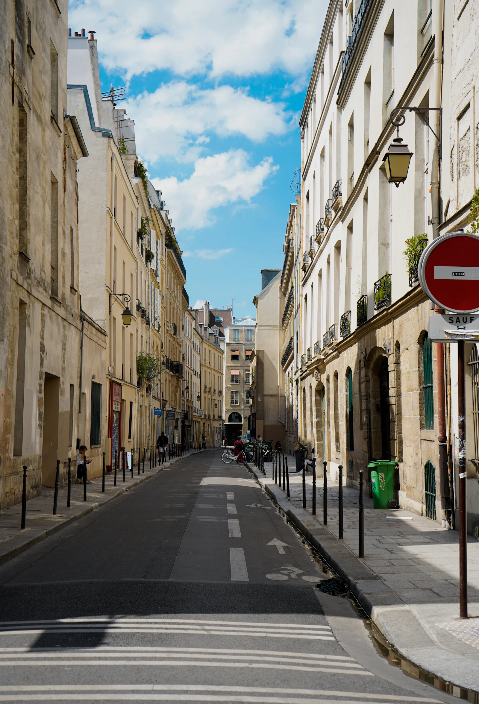 Narrow French city street marked with a no-entry sign