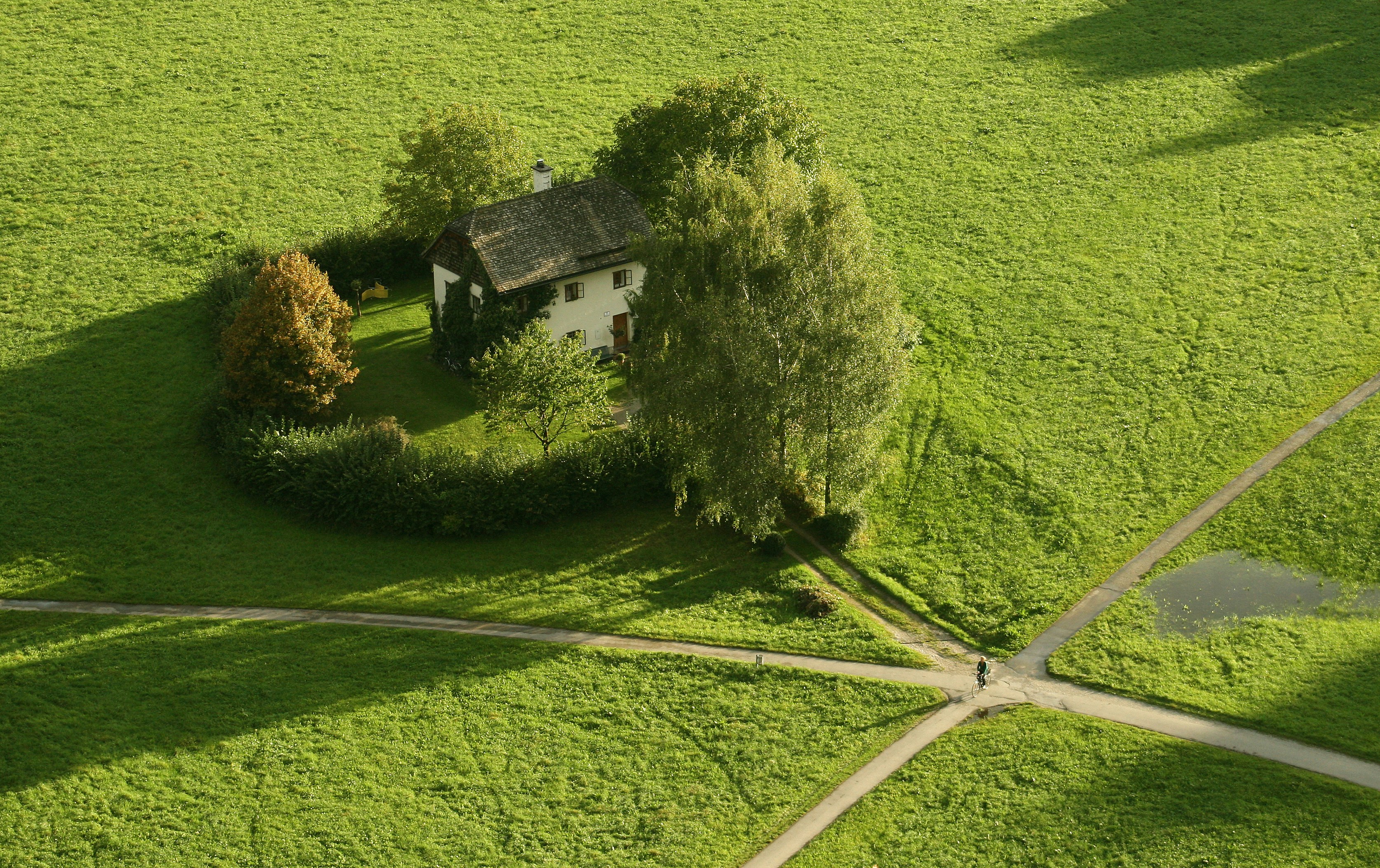a house in a green field