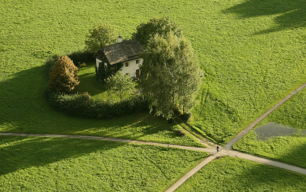 a house in a green field