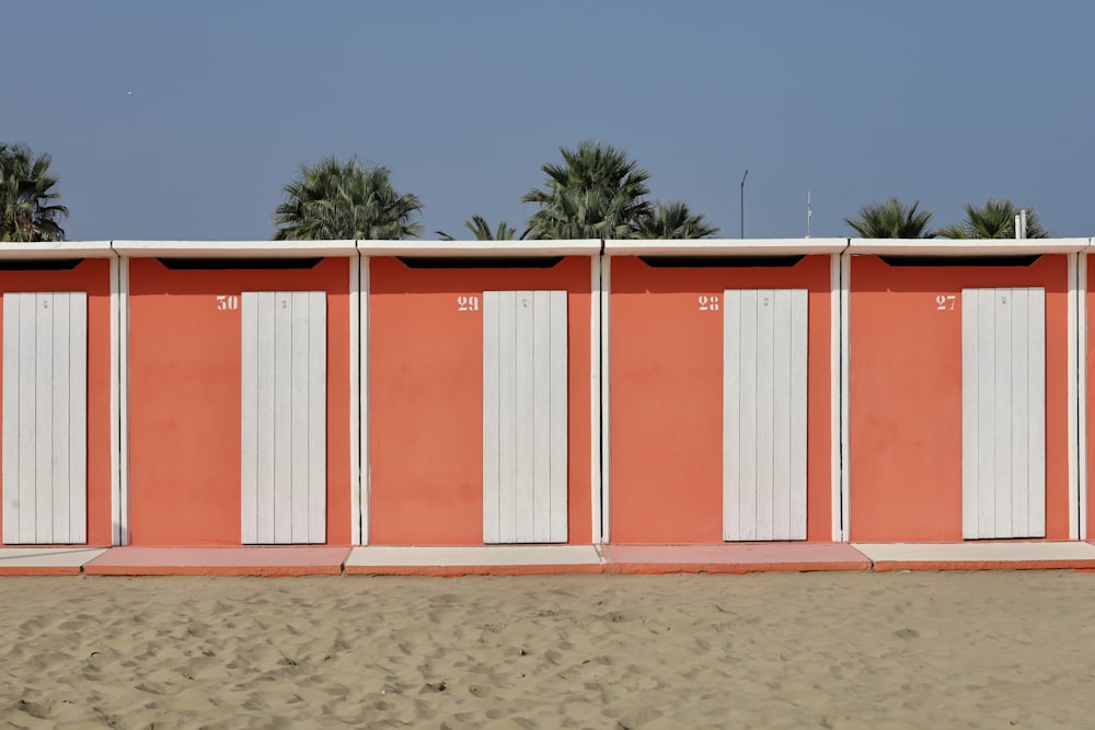 a row of white and red shipping containers