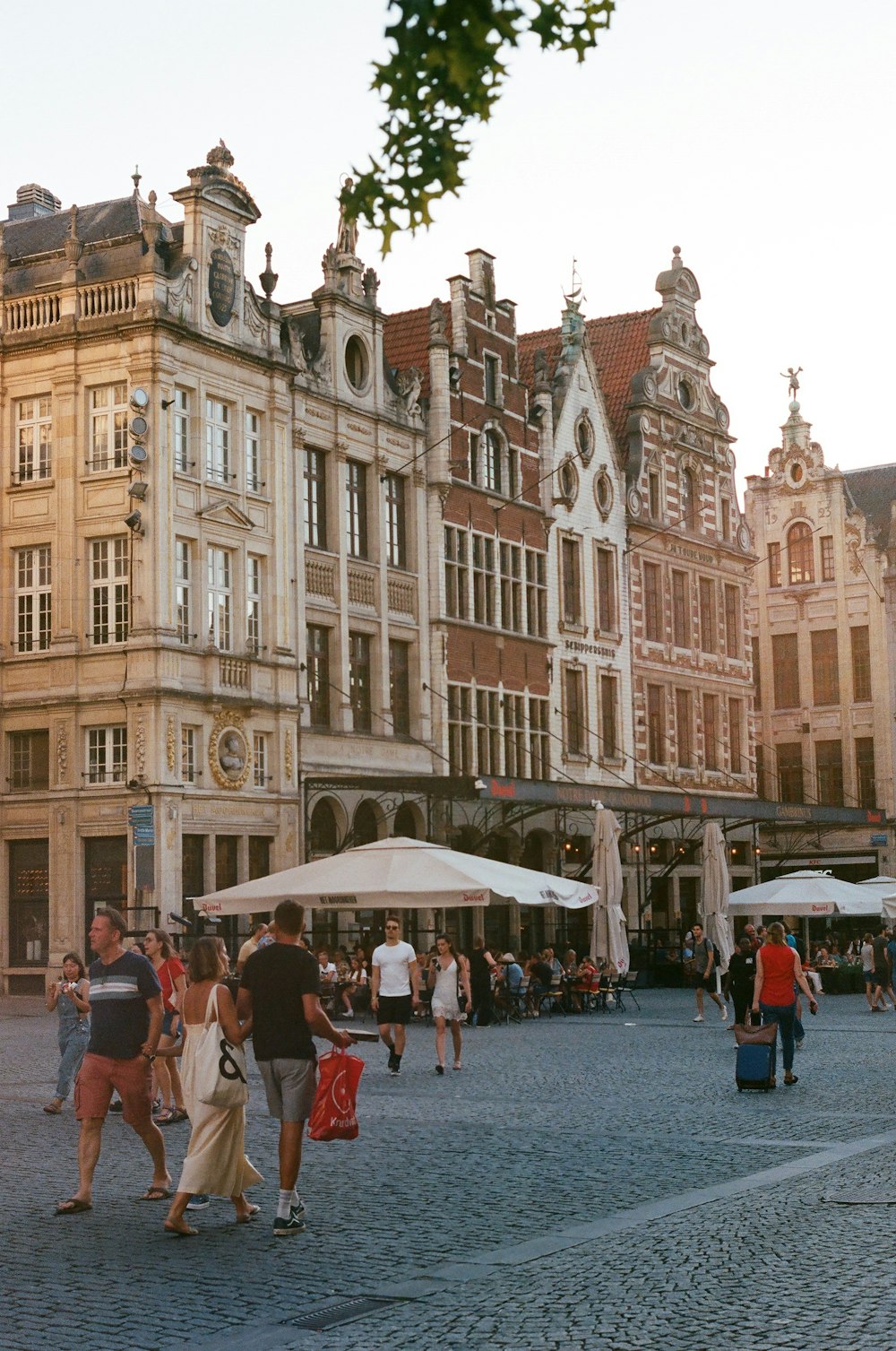 a group of people walking in front of a building