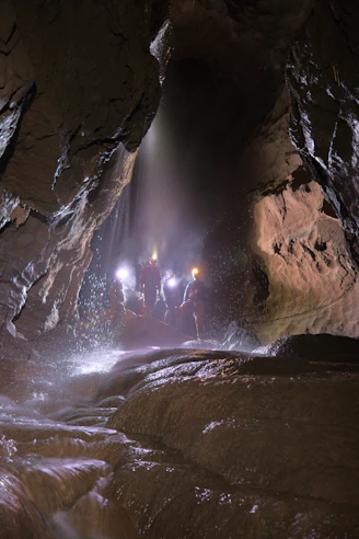 a person standing in a cave