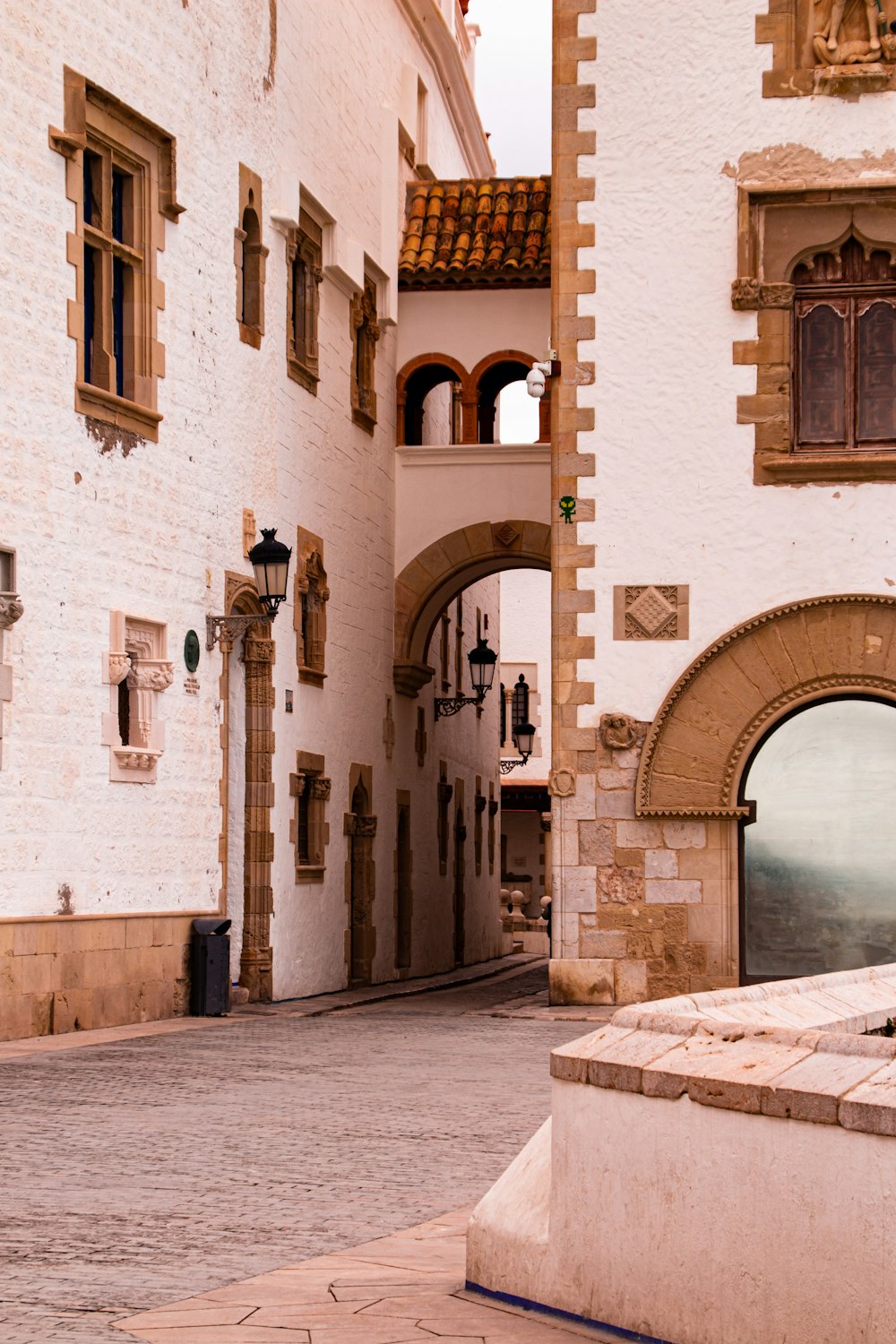 a stone street with buildings on either side of it