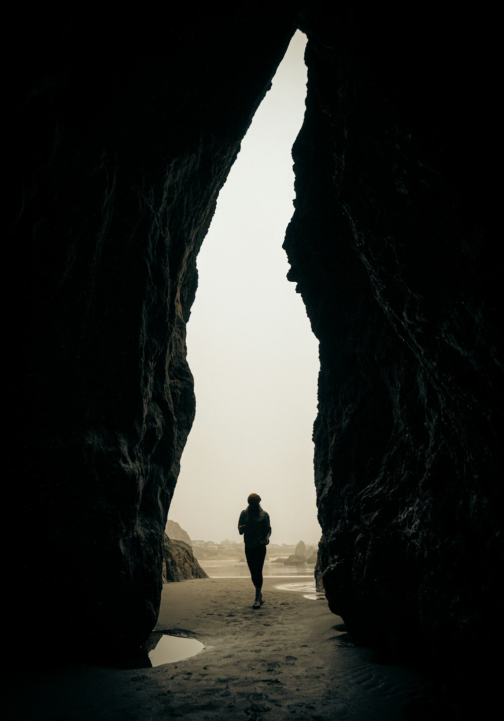 a person walking through a cave