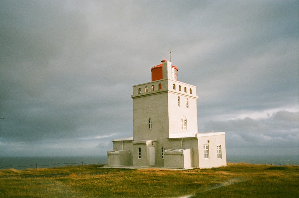 a white building with a red top