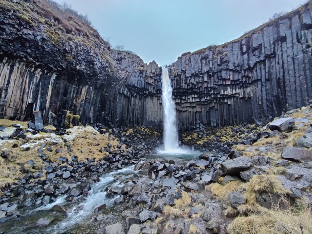 a waterfall in a rocky area