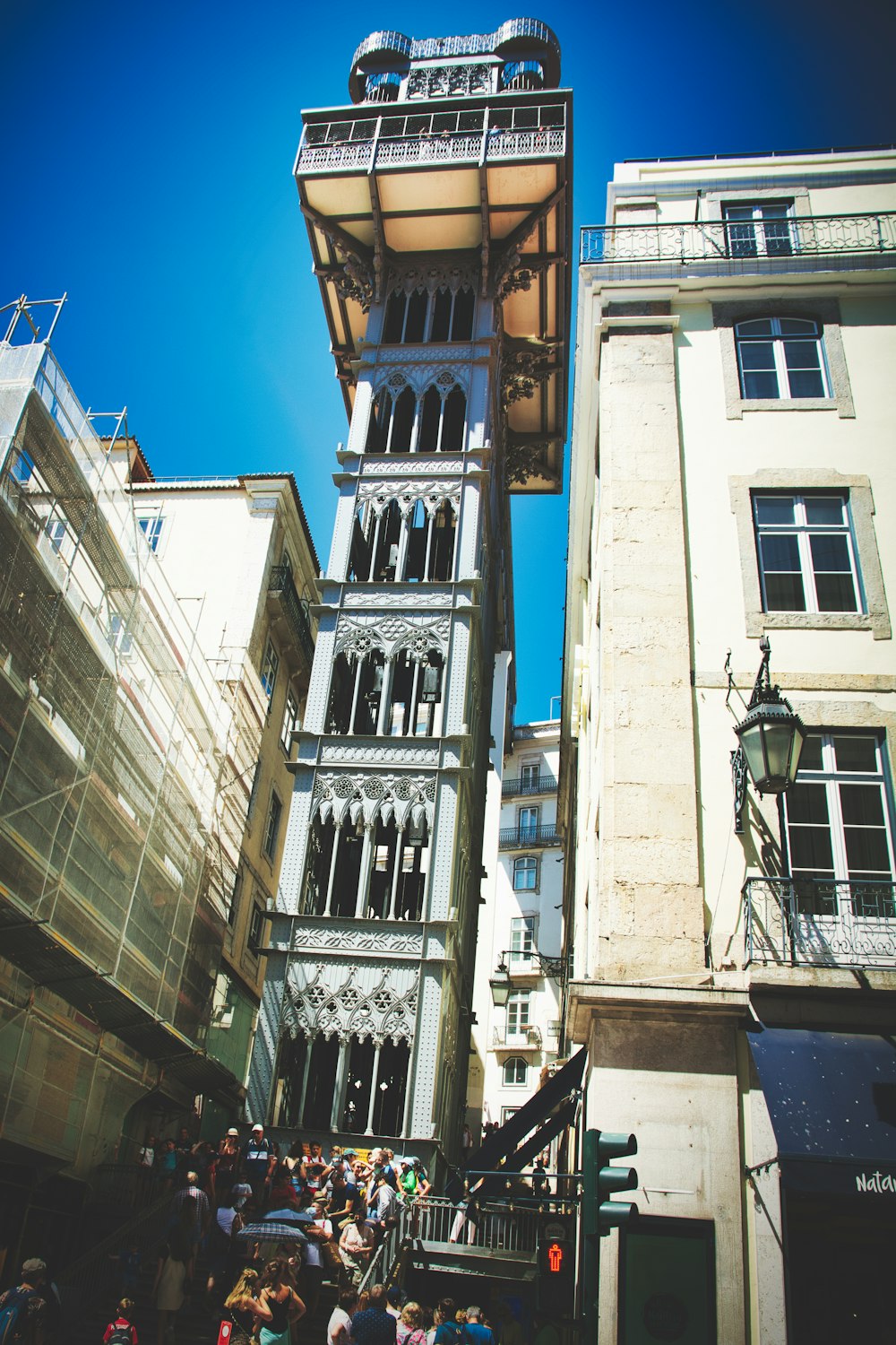 a tall building with a crowd of people in front of it