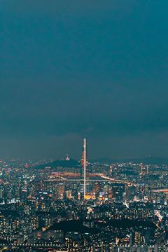 Elegant penthouse with panoramic city skyline views at night.