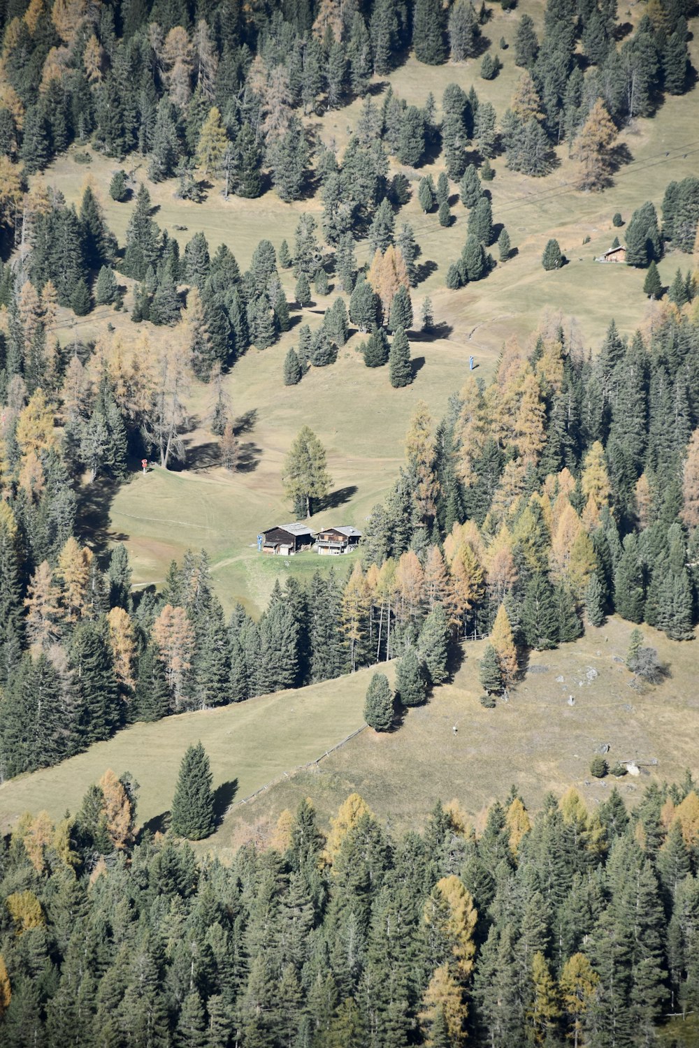 a house in a valley with trees