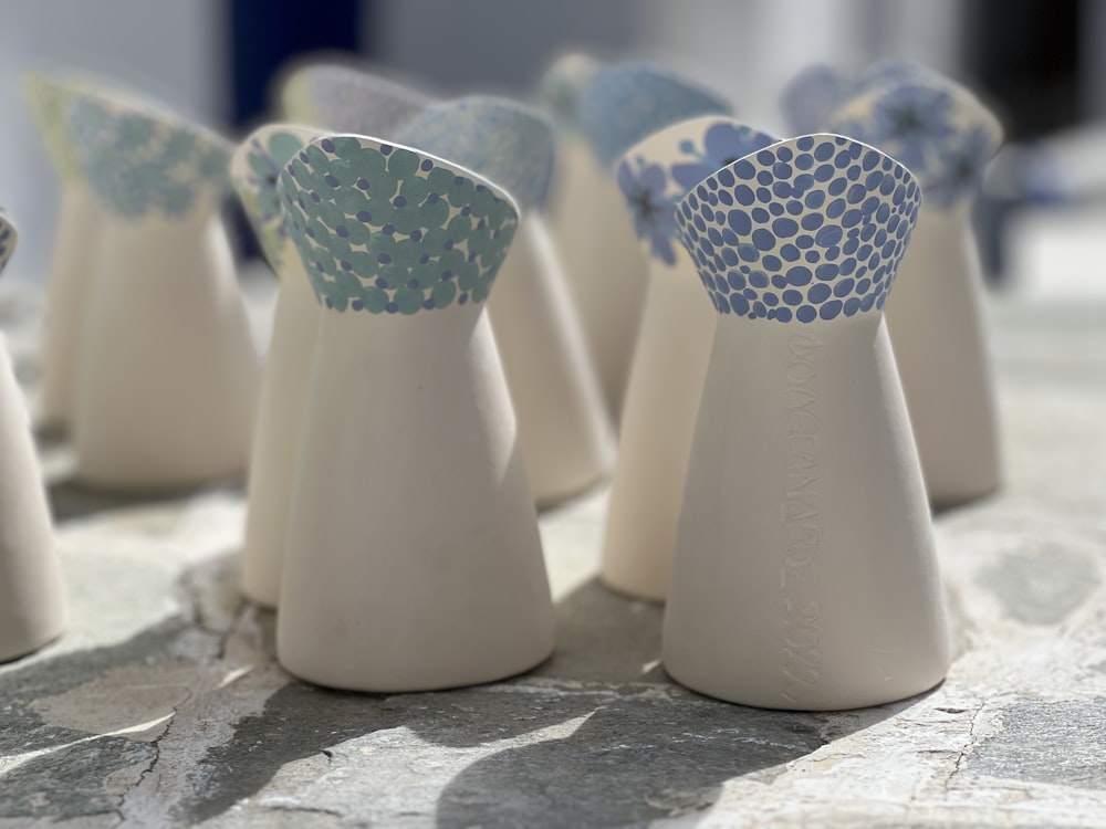 a group of white vases