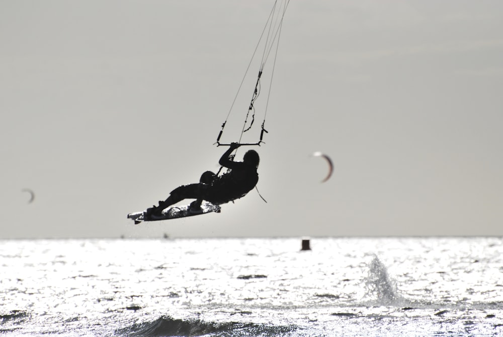 a person parasailing on the water