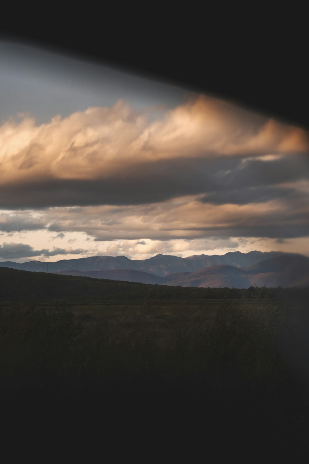 a landscape with mountains in the background