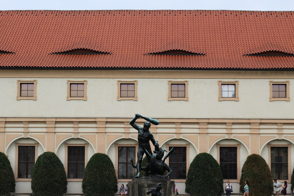 a statue in front of a building