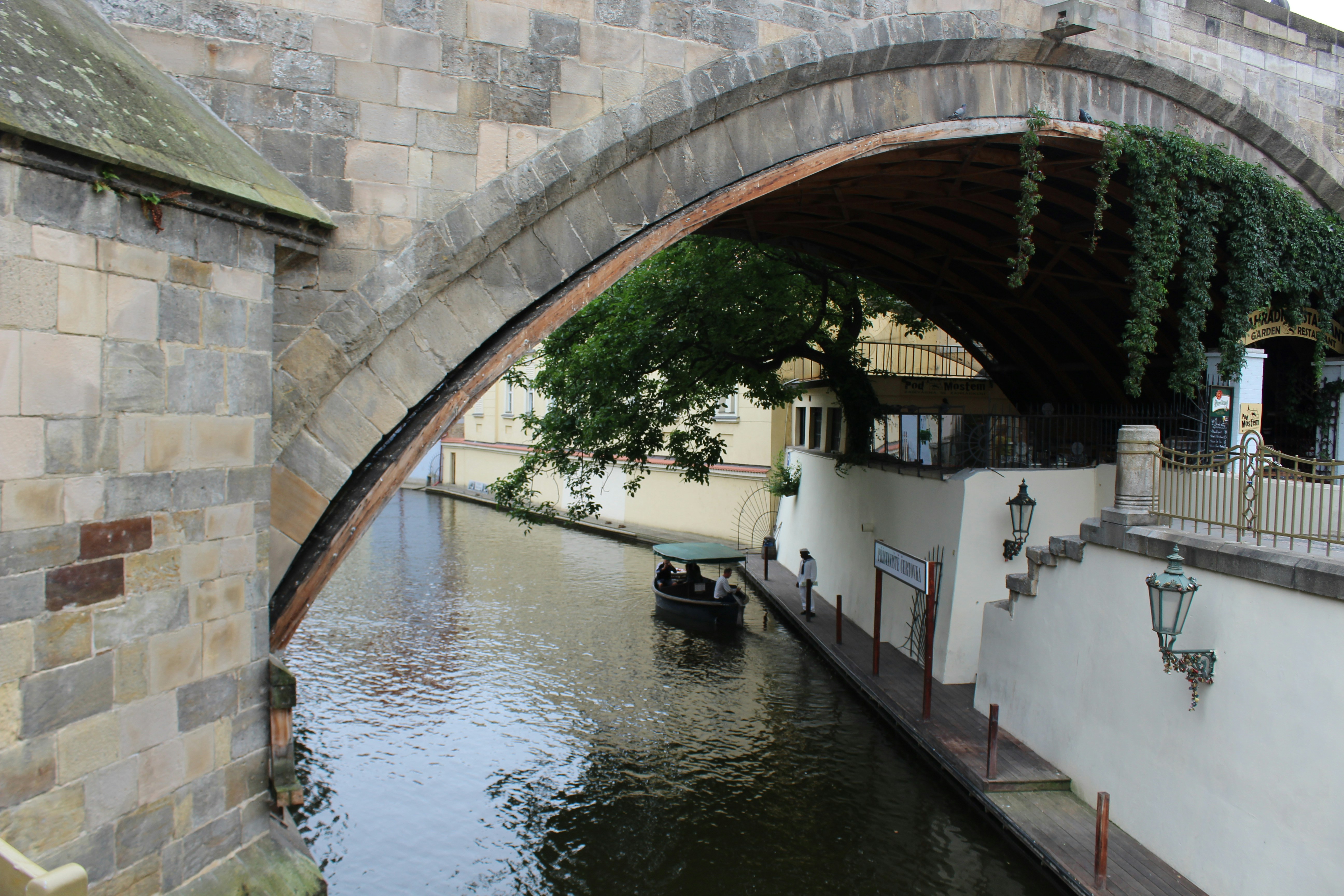 a boat under a bridge
