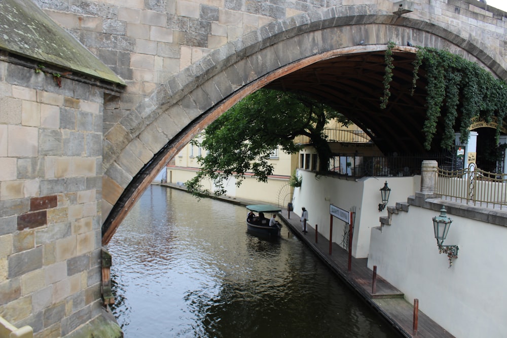 a boat under a bridge