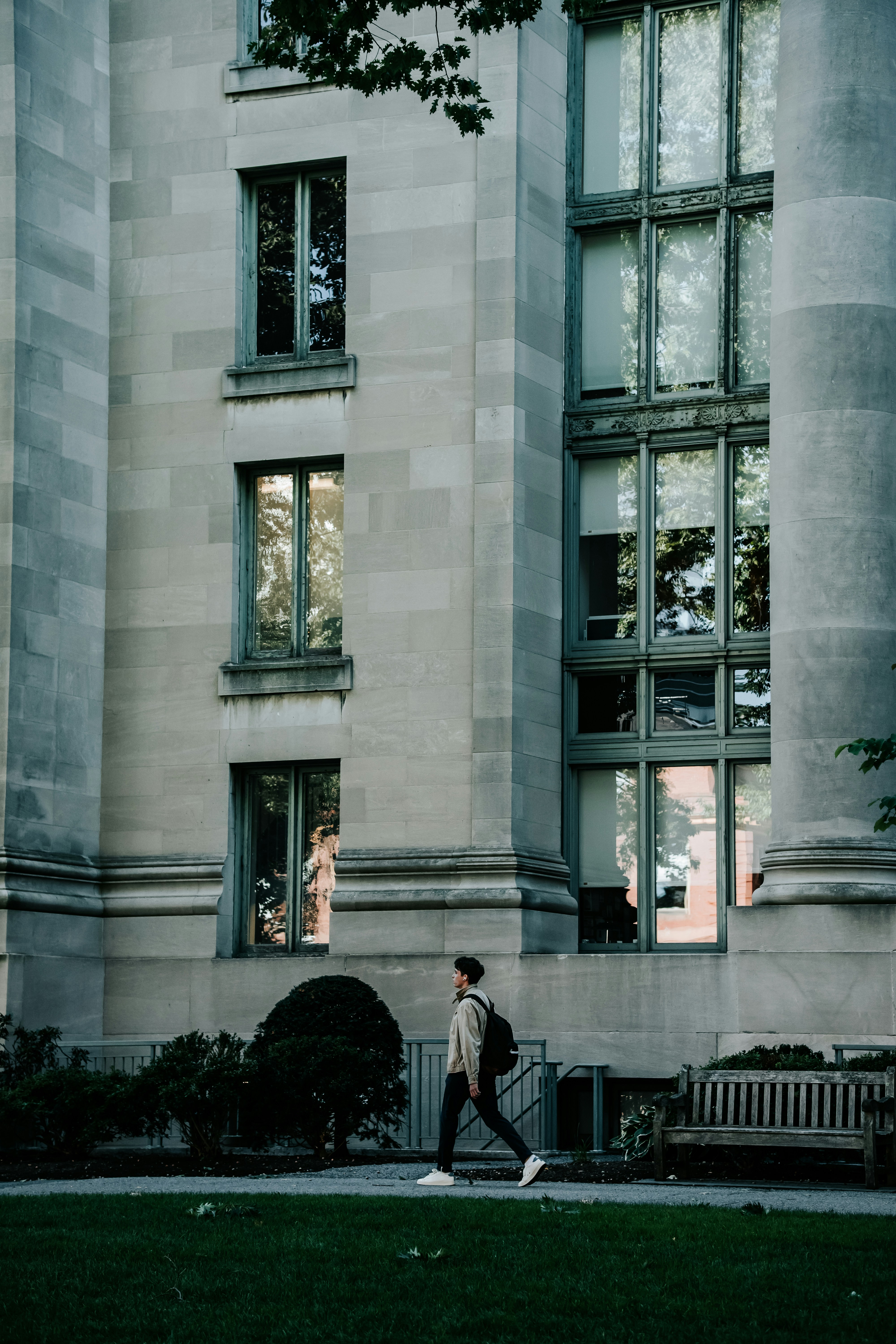 a person walking in front of a building