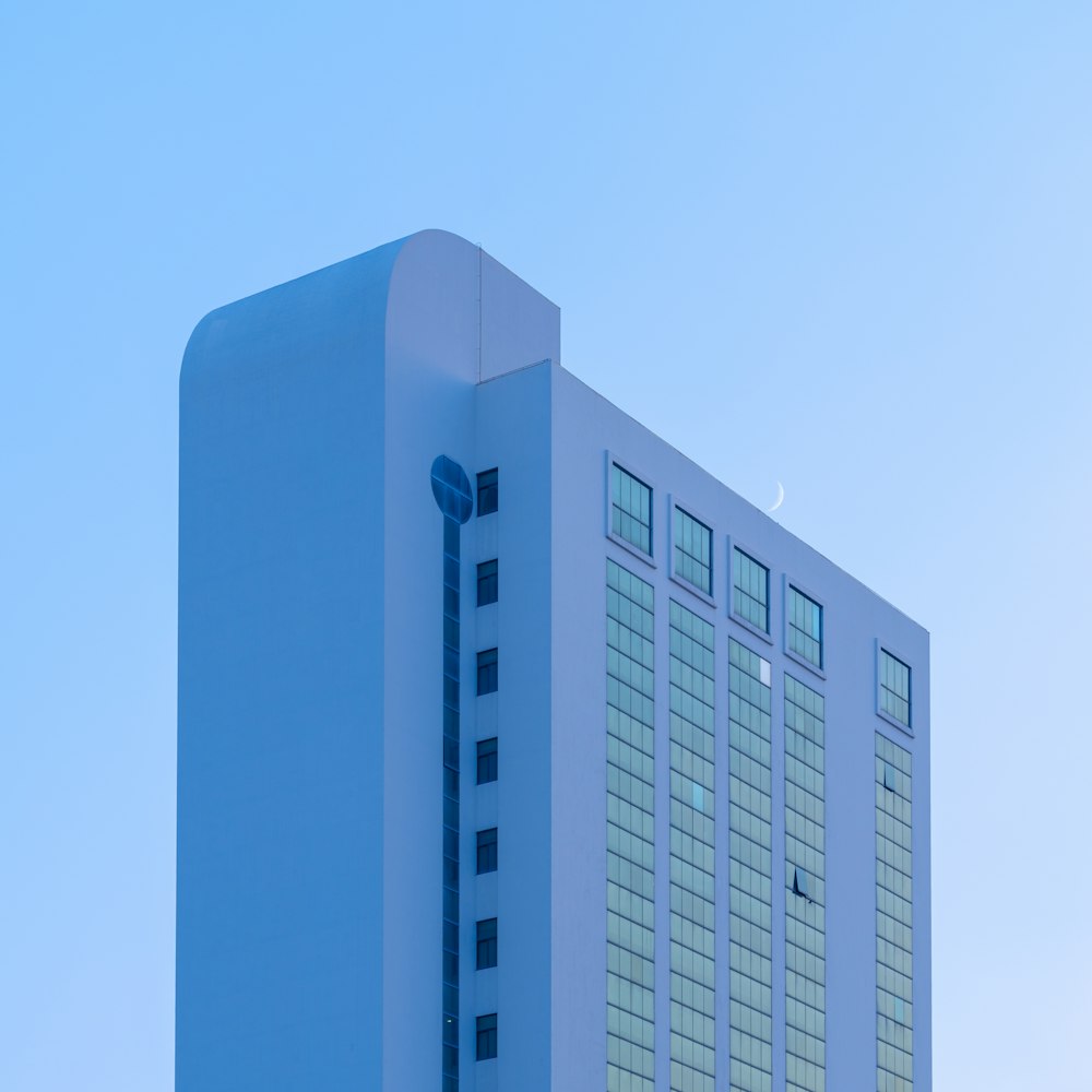 a tall building with a blue sky