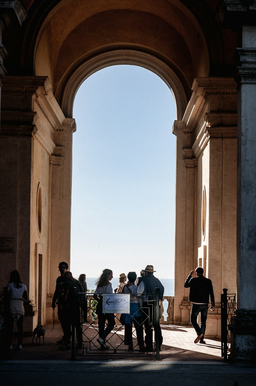 a group of people standing in a large building