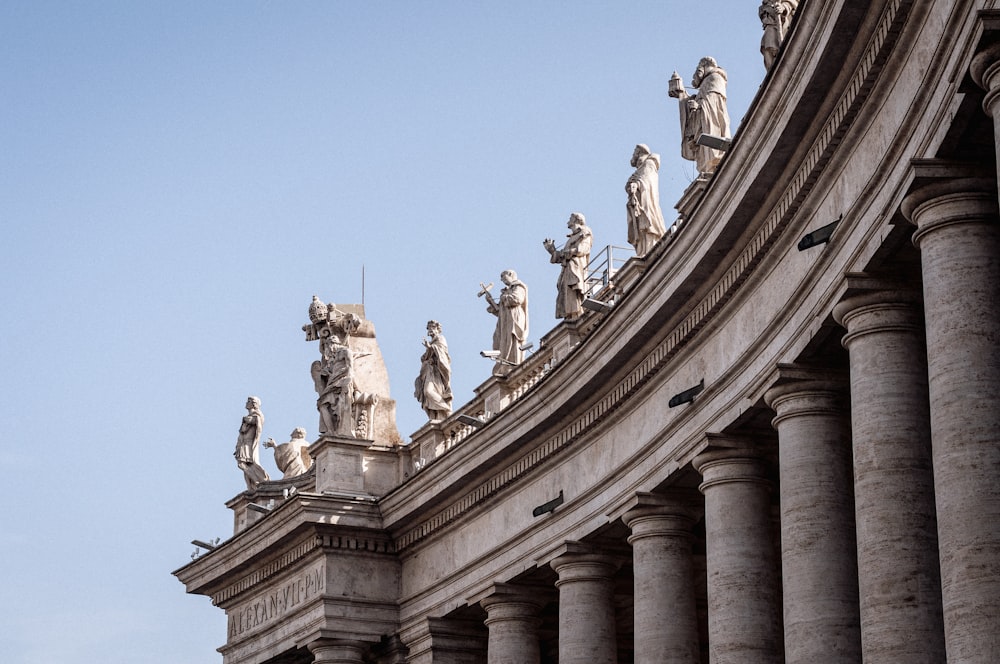 a building with statues on the roof