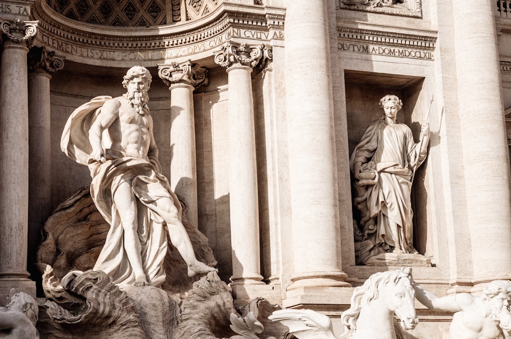 a statue of a man and a woman sitting on a horse