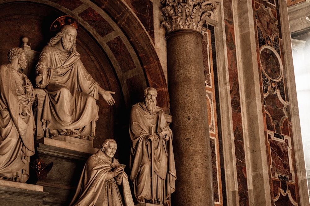 a group of statues in a building