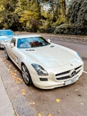 a white car parked on the side of a road