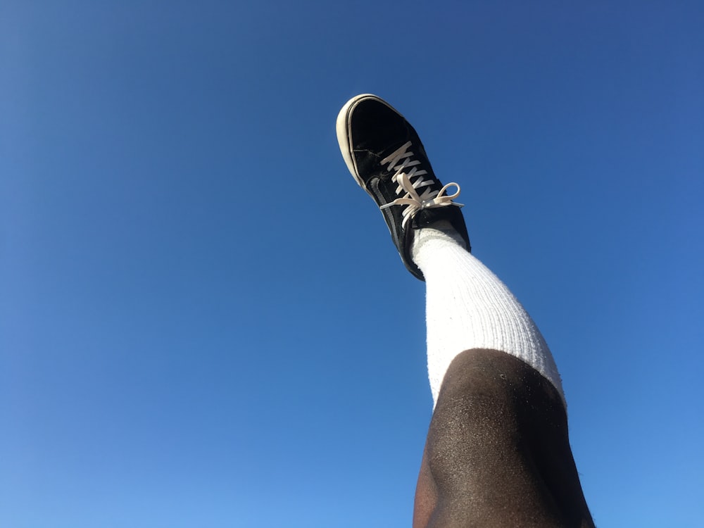 a person's leg with a shoe on it