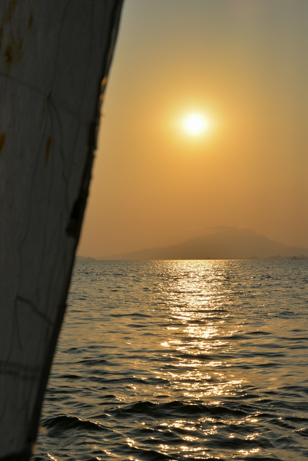 a body of water with a sunset