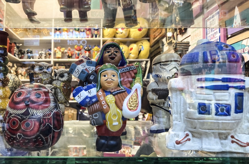 a group of figurines in a store