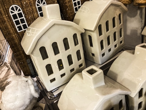 A collection of various steel house models displayed.