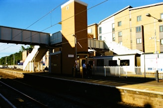 a train station with people waiting