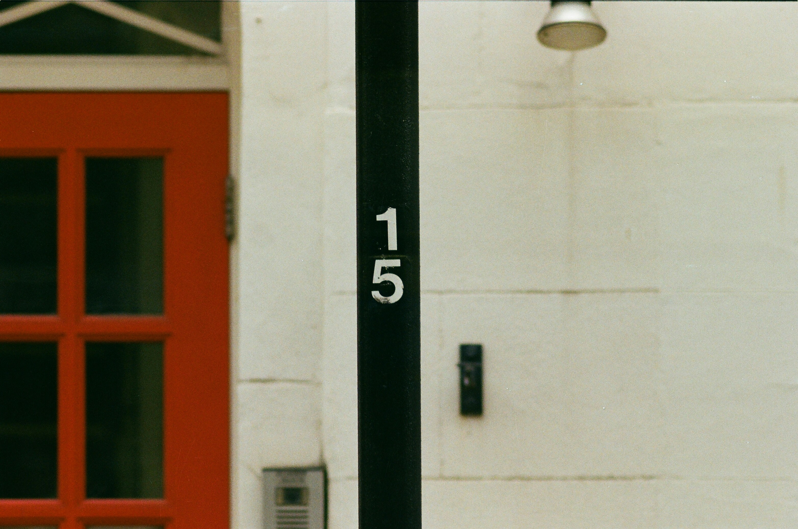 a black pole with a white sign on it