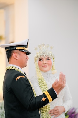 a man and woman in formal attire