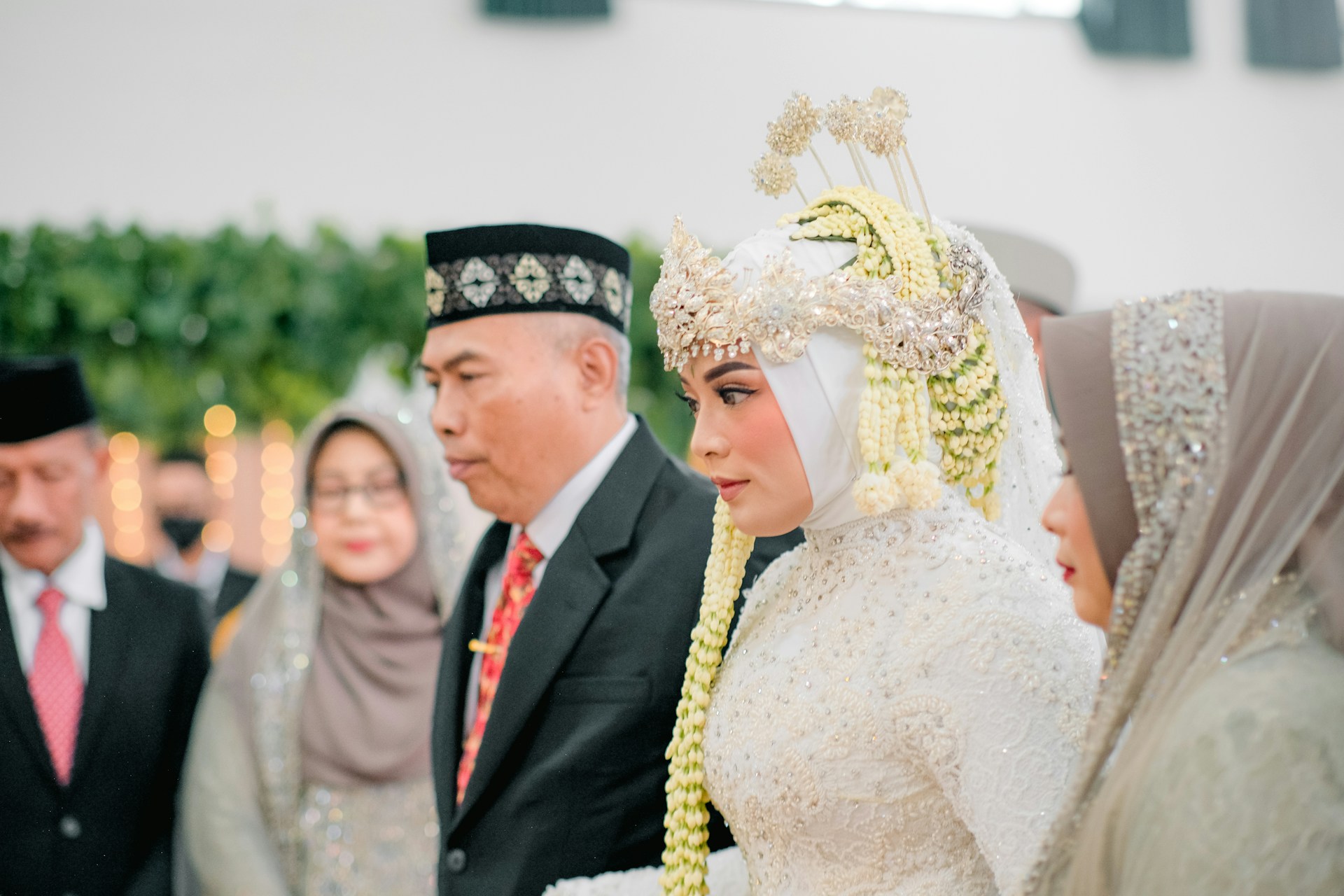 a man in a suit and a woman in a crown