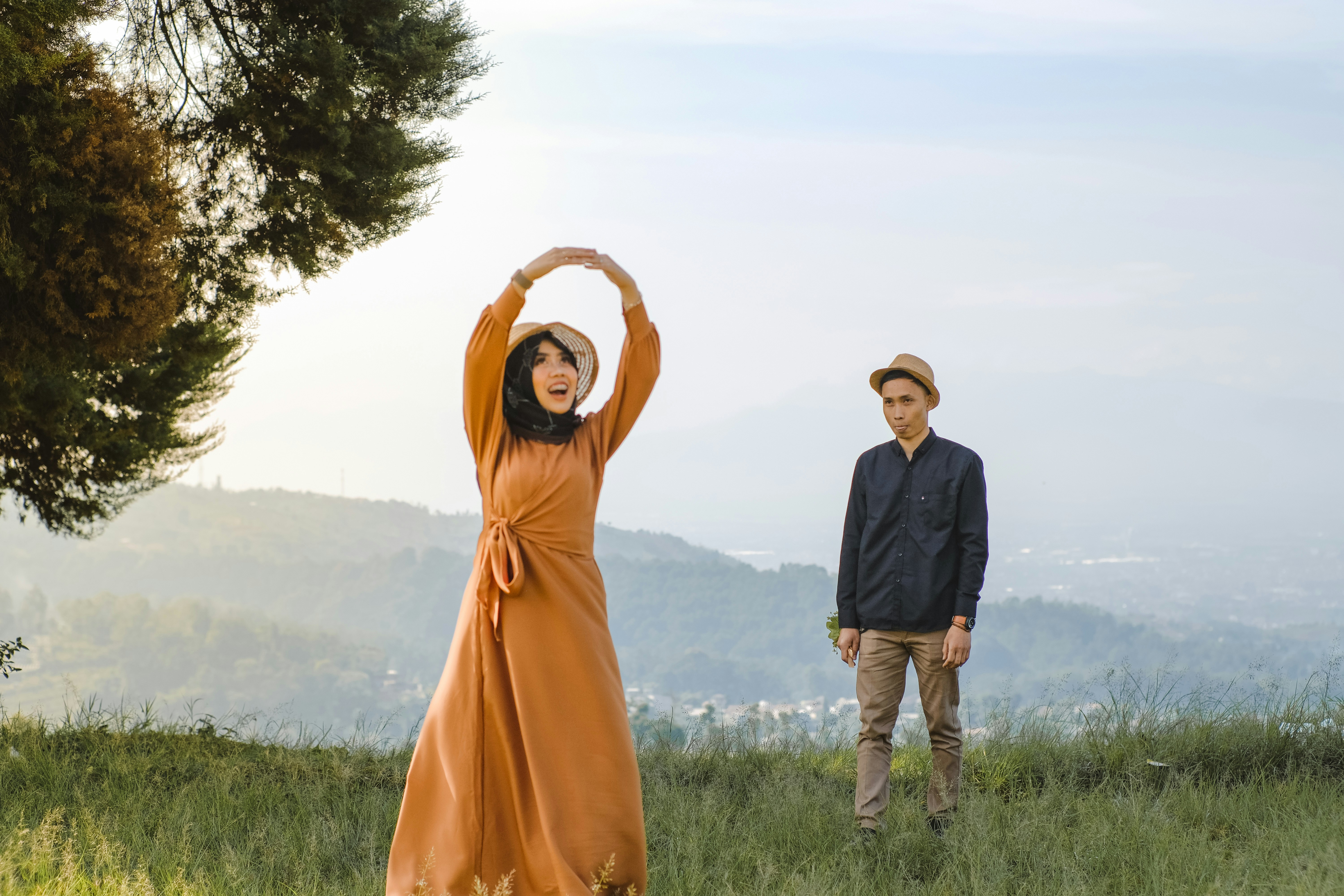 a man standing next to a person in a robe