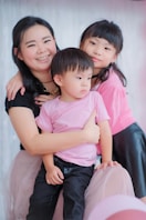 a woman and two children