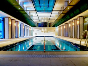 a swimming pool in a large indoor building