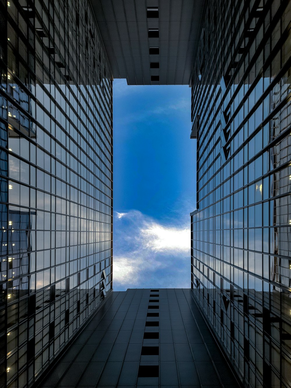 a view of the sky through a window of a building