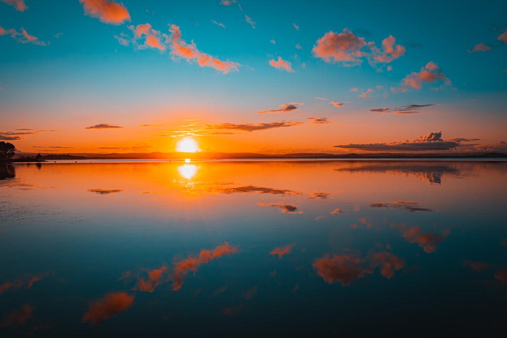 a sunset over a body of water