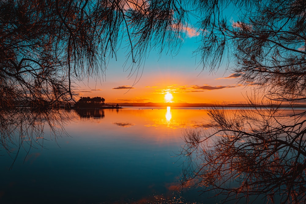 a sunset over a lake