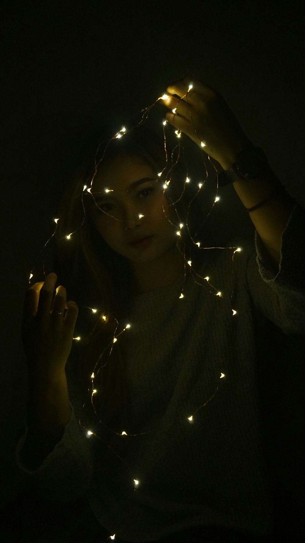 a person holding a light bulb