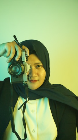 a woman holding a camera