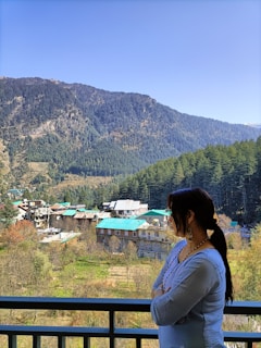 Investor enjoying a peaceful morning on the cottage balcony overlooking the valley.
