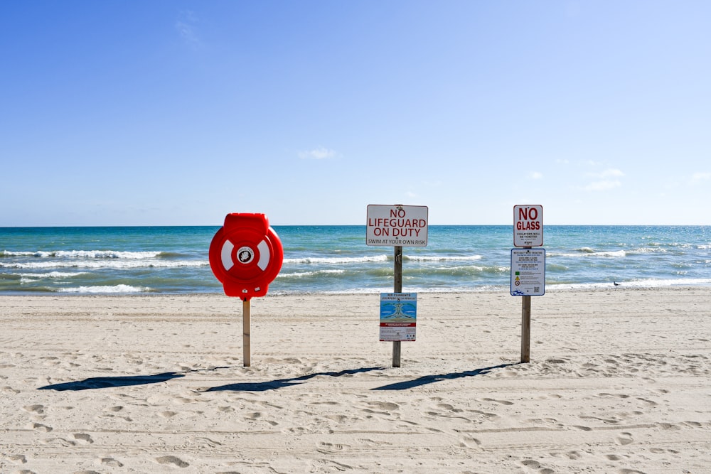 a stop sign on the beach