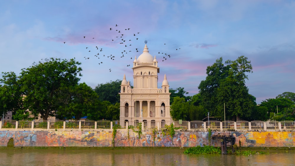 a building with a dome and a fence around it