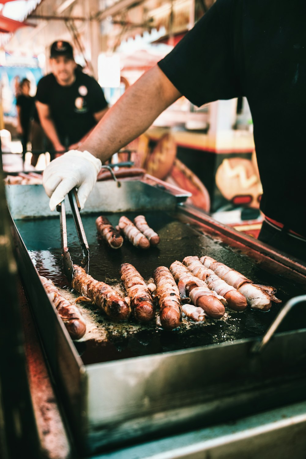 a man cooking food on a grill