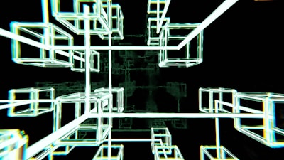 Interconnected glowing wireframe cubes create a futuristic and abstract geometric structure against a dark background.