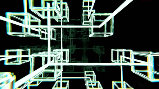 Interconnected glowing wireframe cubes create a futuristic and abstract geometric structure against a dark background.